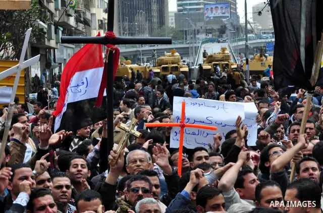 Egyptian Coptic Christians take part in a protest in front of the Information center building in Cairo, Egypt, 09 March 2011. The Coptic Christians were protesting over the burning of a church in Cairo suburbs on 04 Marc...