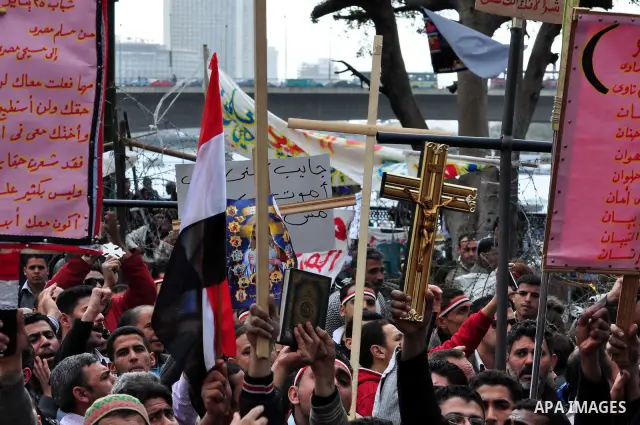 Egyptian Coptic Christians take part in a protest in front of the Information center building in Cairo, Egypt, 09 March 2011. The Coptic Christians were protesting over the burning of a church in Cairo suburbs on 04 Marc...