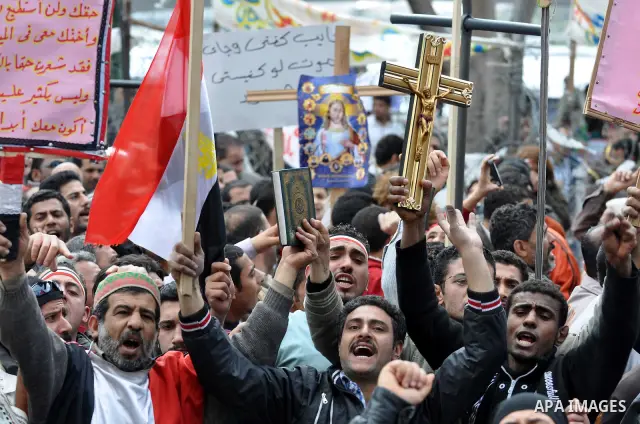 Egyptian Coptic Christians take part in a protest in front of the Information center building in Cairo, Egypt, 09 March 2011. The Coptic Christians were protesting over the burning of a church in Cairo suburbs on 04 Marc...