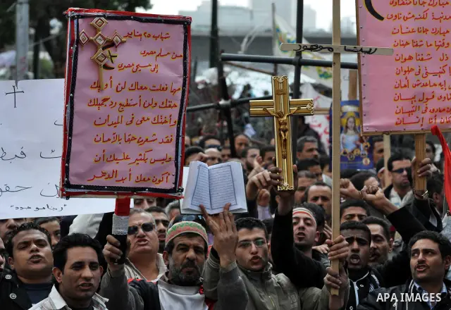 Egyptian Coptic Christians take part in a protest in front of the Information center building in Cairo, Egypt, 09 March 2011. The Coptic Christians were protesting over the burning of a church in Cairo suburbs on 04 Marc...
