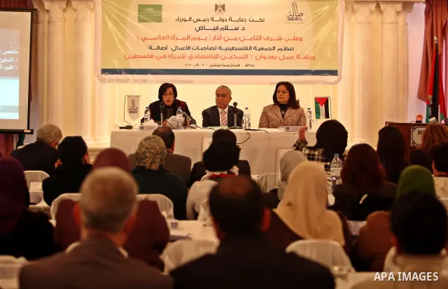Palestinian prime minister Salam fayyad attend a meeting to mark the international women's day . Photo by Abed Rahim Khatib