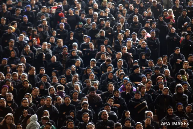 Egyptian Coptic Christians gather for a mass funeral procession at the Samaan el-Kharaz Church in Cairo on March 10, 2011 after at least 13 people were killed in sectarian clashes which erupted when 1,000 Christians gath...