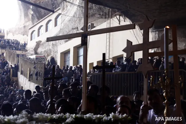 Egyptian Coptic Christians gather for a mass funeral procession at the Samaan el-Kharaz Church in Cairo on March 10, 2011 after at least 13 people were killed in sectarian clashes which erupted when 1,000 Christians gath...