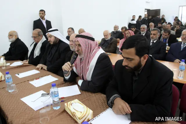 Palestinian Legislative Council members participate in a meeting to discuss the new government headed by Ismail Haneiyah in Gaza city on March 10,2011. Photo by Mohammed Asad