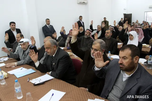 Palestinian Legislative Council members participate in a meeting to discuss the new government headed by Ismail Haneiyah in Gaza city on March 10,2011. Photo by Mohammed Asad