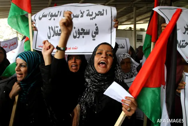 Palestinian women take part in a demonstration organized by the Democratic Front for the Liberation of Palestine (DFLP), calling to end the Palestinian internal division between Hamas and Fatah, outside the International...