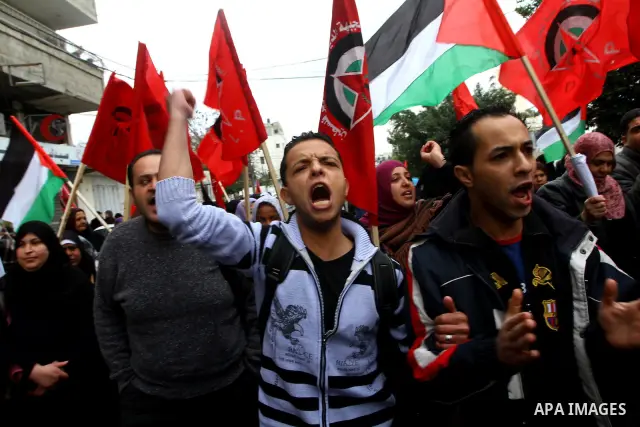 Palestinians take part in a demonstration organized by the Democratic Front for the Liberation of Palestine (DFLP), calling to end the Palestinian internal division between Hamas and Fatah, outside the International Red...