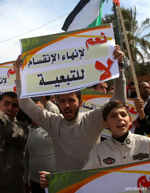 Palestinians attend a rally calling for national reconciliation between the rival Palestinian leading factions Hamas in Gaza and Fatah in the West Bank, in Gaza City, Friday, March 11, 2011. Members of major Palestinian...