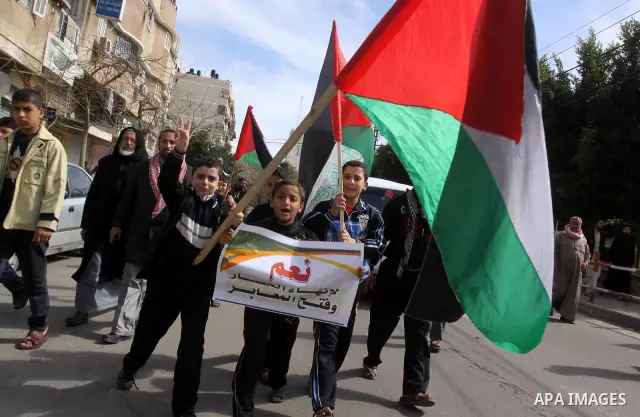 Palestinians attend a rally calling for national reconciliation between the rival Palestinian leading factions Hamas in Gaza and Fatah in the West Bank, in Gaza City, Friday, March 11, 2011. Members of major Palestinian...