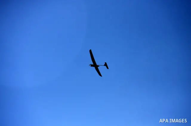 Israeli soldiers launch a drone near the West Bank village of Awarta on March 12, 2011 as troops were hunting a suspected Palestinian who killed five members of an Israeli family at a settlement, officials and media repo...