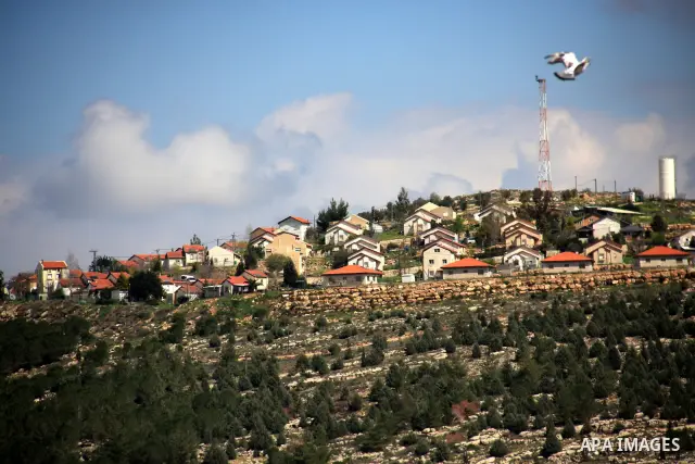 A general view shows the Jewish settlement of Itamar behind the West Bank village of Awarta on March 12, 2011. An attack blamed on Palestinians killed five members of an Israeli family in their beds in Itamar, sparking a...