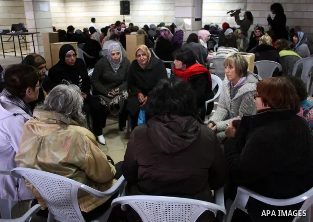 Palestinian and israeli women take part in a Palestinian_Jewish conference of the occasion of the 100th International Womens Day on March 12,2011 in Beit Omar village near the West Bank city of Hebron. Photo by Najeh Has...