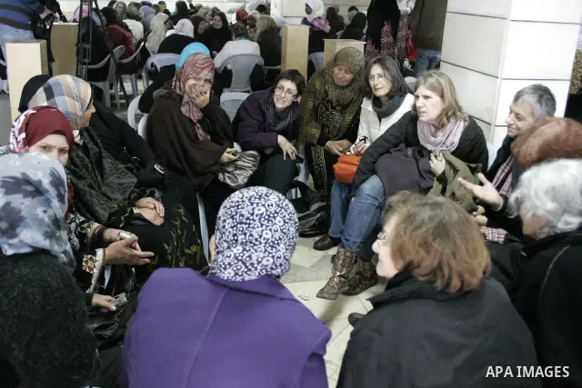 Palestinian and israeli women take part in a Palestinian_Jewish conference of the occasion of the 100th International Womens Day on March 12,2011 in Beit Omar village near the West Bank city of Hebron. Photo by Najeh Has...