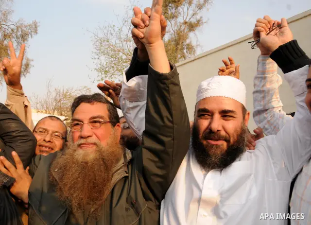 Egyptian Abbud and Tareq al-Zomor, members of Egypt's Islamic Jihad, are seen after being released form the Tura jail, in Hilwan on the outskirts of Cairo, on March 12, 2011, after Egypt's new military rulers ordered the...
