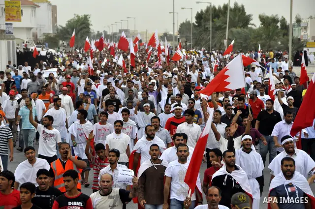 Tens of thousands of Bahraini anti-government protesters converged from two directions Saturday, March 12, 2011, to demonstrate outside the walls of King Hamad bin Isa Al Khalifa's Safriya palace in Sadad, Bahrain, south...