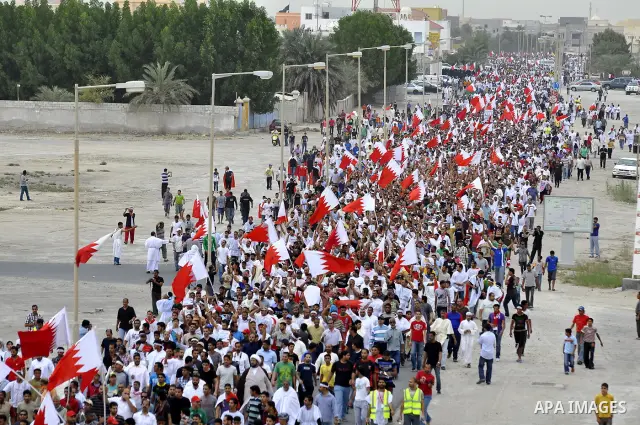 Tens of thousands of Bahraini anti-government protesters converged from two directions Saturday, March 12, 2011, to demonstrate outside the walls of King Hamad bin Isa Al Khalifa's Safriya palace in Sadad, Bahrain, south...
