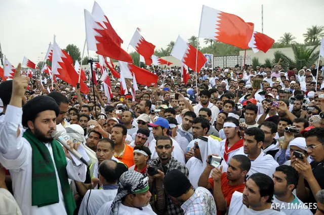 Tens of thousands of Bahraini anti-government protesters converged from two directions Saturday, March 12, 2011, to demonstrate outside the walls of King Hamad bin Isa Al Khalifa's Safriya palace in Sadad, Bahrain, south...