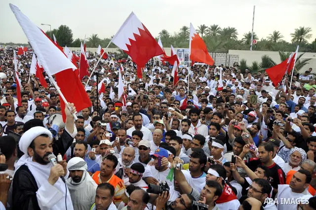 Tens of thousands of Bahraini anti-government protesters converged from two directions Saturday, March 12, 2011, to demonstrate outside the walls of King Hamad bin Isa Al Khalifa's Safriya palace in Sadad, Bahrain, south...