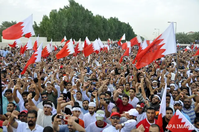 Tens of thousands of Bahraini anti-government protesters converged from two directions Saturday, March 12, 2011, to demonstrate outside the walls of King Hamad bin Isa Al Khalifa's Safriya palace in Sadad, Bahrain, south...