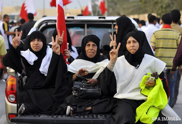 Tens of thousands of Bahraini anti-government protesters converged from two directions Saturday, March 12, 2011, to demonstrate outside the walls of King Hamad bin Isa Al Khalifa's Safriya palace in Sadad, Bahrain, south...