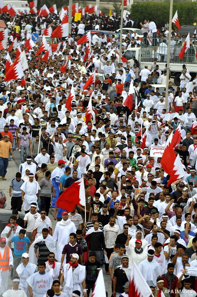 Tens of thousands of Bahraini anti-government protesters converged from two directions Saturday, March 12, 2011, to demonstrate outside the walls of King Hamad bin Isa Al Khalifa's Safriya palace in Sadad, Bahrain, south...