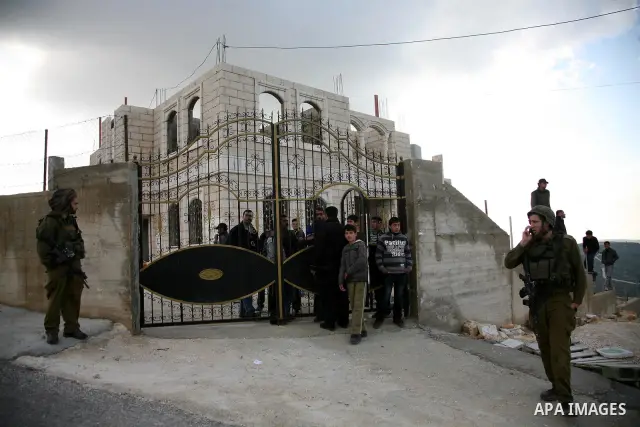 Israeli soldiers take position at Awarta Village south of the West Bank city of Nablus during a search operation on 12 March ,2011. The Israeli army announced the Palestinian city as closed military zone following the ki...