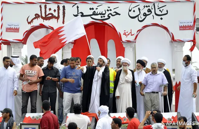 Anti-government protesters rush to a highway overpass in Manama, Bahrain, as riot police pull out, Sunday, March 13, 2011, after pushing demonstrators back from the financial area with tear gas and rubber bullets. Riot p...