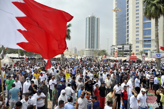 Bahraini anti-government protesters demonstrate near the Pearl roundabout Sunday, March 13, 2011, in Manama, Bahrain. Photo by Ammar A.rasool