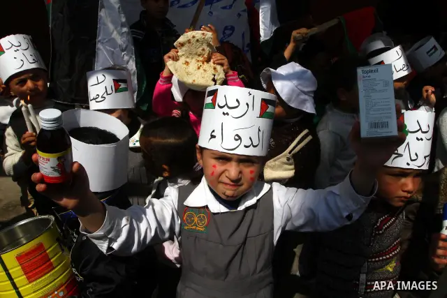 Palestinian students attend a gathering calling for ending the siege in front of the United Nations Relief and Works Agency (UNRWA) headquarters in Gaza City on March 13,2011. Photo by Ashraf Amra