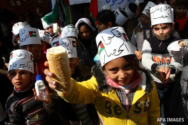 Palestinian students attend a gathering calling for ending the siege in front of the United Nations Relief and Works Agency (UNRWA) headquarters in Gaza City on March 13,2011. Photo by Ashraf Amra