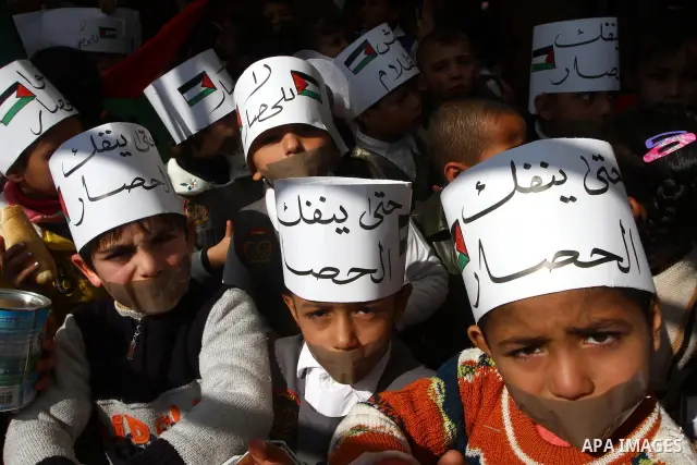 Palestinian students attend a gathering calling for ending the siege in front of the United Nations Relief and Works Agency (UNRWA) headquarters in Gaza City on March 13,2011. Photo by Ashraf Amra