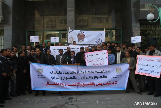Palestinian journalists participate in a press conference against killing of Al-Jazeera's cameraman by Al Ghadafi forces in Libya, in Gaza city on March 13 2011 . Photo by Ashraf Amra
