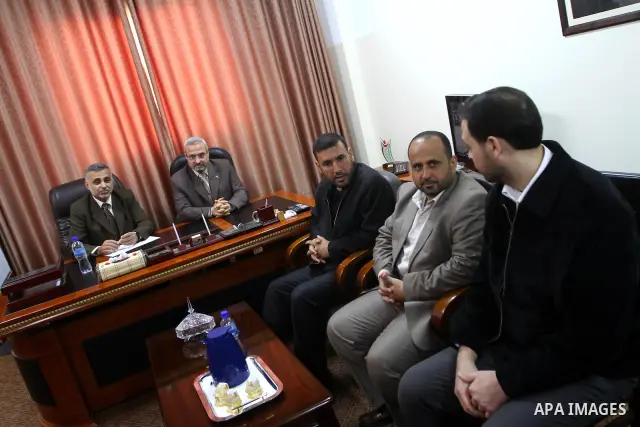 Palestinian minister, Mohammed Asqoul receives the General Secretariat of the Council of Ministers from the minister, Mohammed Awad in Gaza City on March 13,2011. Photo by Ashraf Amra