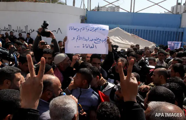 Palestinian lost their homes during the Israeli war in 2008-2009 attend a gathering calling for ending the siege in front of the United Nations Relief and Works Agency (UNRWA) headquarters in Gaza City March 13,2011. Pho...