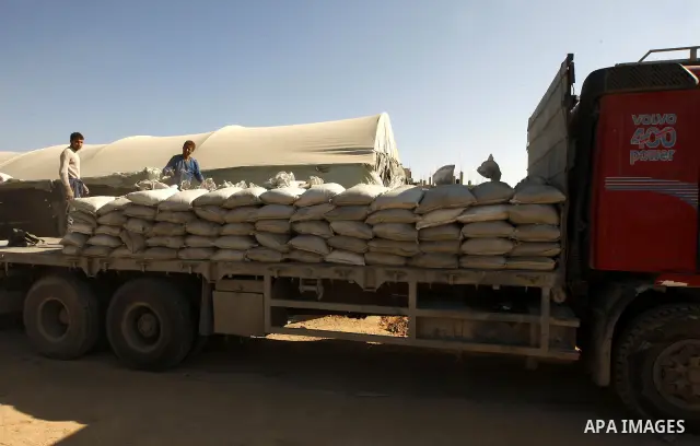 Palestinian men smuggle cement into the Gaza Strip through a tunnel under the Egypt-Gaza border in Rafah on March 14, 2011. Israel's blockade of the Gaza Strip was imposed after the militant Hamas group violently seized...