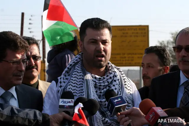 Palestinian activist Abdullah Abu Rahma , 39, the coordinator of the Popular Committee against the Wall and Settlements in Bilin, speaks to media after his release from Israel's Ofer prison following 16 months in jail on...
