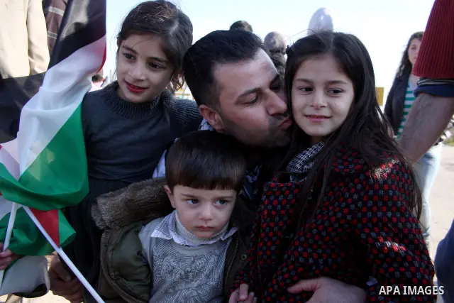 Palestinian activist Abdullah Abu Rahma , 39, the coordinator of the Popular Committee against the Wall and Settlements in Bilin, is welcomed by relatives after his release from Israel's Ofer prison following 16 months i...