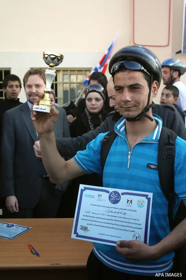 Palestinians compete during cycling race in the West Bank city of Hebron on March 14,2011.This event is the first of it kind on the local level and it was organized by the Palestinian Ministery of youth and sport as a pr...