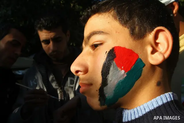 Palestinians participate in a march calling for a reconciliation between the rival Palestinian leading factions Hamas in Gaza and Fatah in the West Bank, in Gaza City, Monday, March 14, 2011. Photo by Ashraf Amra