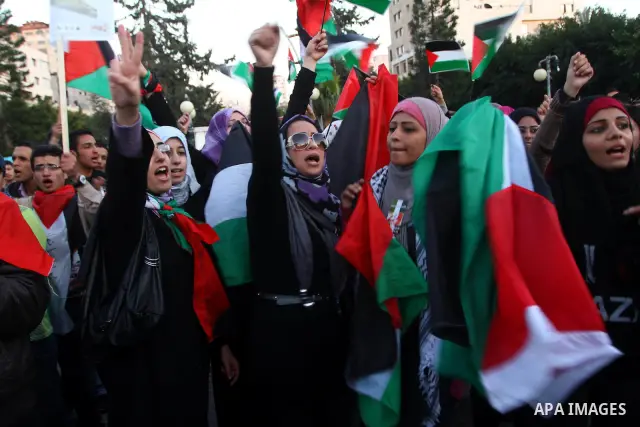 Palestinians participate in a march calling for a reconciliation between the rival Palestinian leading factions Hamas in Gaza and Fatah in the West Bank, in Gaza City, Monday, March 14, 2011. Photo by Ashraf Amra