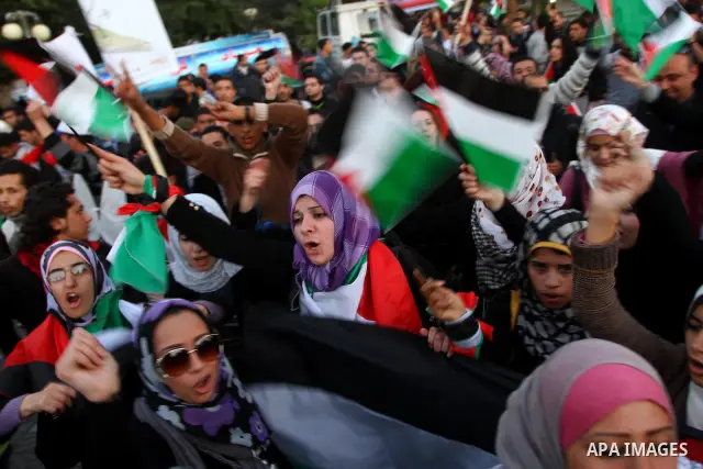 Palestinians participate in a march calling for a reconciliation between the rival Palestinian leading factions Hamas in Gaza and Fatah in the West Bank, in Gaza City, Monday, March 14, 2011. Photo by Ashraf Amra