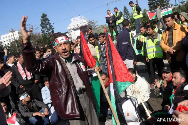 Palestinians youths take apart during a rally calling for a reconciliation between the rival Palestinian leading factions Hamas in Gaza and Fatah in the West Bank, in Gaza City Hundreds of youths demonstrated in the stre...