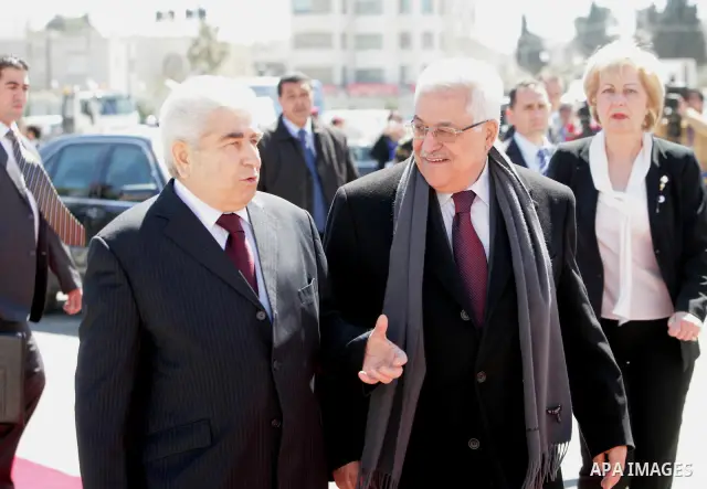Palestinian President Mahmoud Abbas, left, and Cypriot President Dimitris Christofias review an honor guard in the West Bank city of Ramallah March 15, 2011. Christofias is on an official visit to Israel and the Palestin...