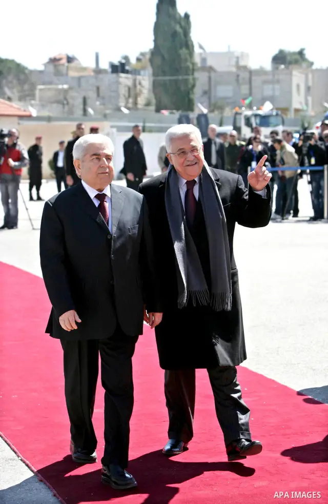 Palestinian President Mahmoud Abbas, left, and Cypriot President Dimitris Christofias review an honor guard in the West Bank city of Ramallah March 15, 2011. Christofias is on an official visit to Israel and the Palestin...