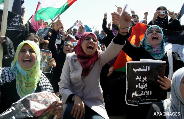 Palestinian demonstrators take part in a protest calling for Palestinian political unity between Gaza's Hamas rulers and the Fatah-dominated Palestinian Authority which rules from Ramallah, on March 15, 2011in Gaza City,...