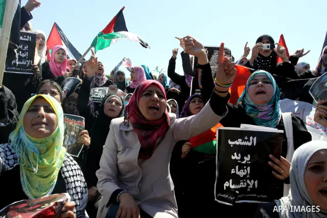 Palestinian demonstrators take part in a protest calling for Palestinian political unity between Gaza's Hamas rulers and the Fatah-dominated Palestinian Authority which rules from Ramallah, on March 15, 2011in Gaza City,...