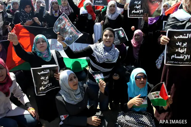 Palestinian demonstrators take part in a protest calling for Palestinian political unity between Gaza's Hamas rulers and the Fatah-dominated Palestinian Authority which rules from Ramallah, on March 15, 2011in Gaza City,...