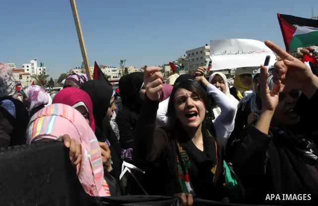 Palestinian demonstrators take part in a protest calling for Palestinian political unity between Gaza's Hamas rulers and the Fatah-dominated Palestinian Authority which rules from Ramallah, on March 15, 2011in Gaza City,...