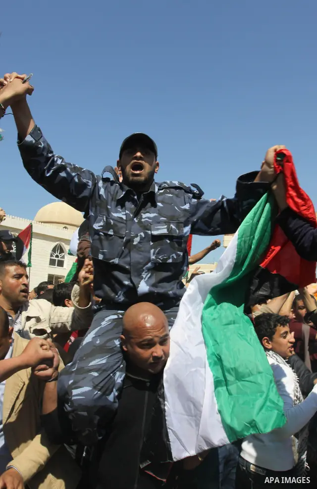 Palestinian Hamas security forces participate with demonstrators in a protest calling for Palestinian political unity between Gaza's Hamas rulers and the Fatah-dominated Palestinian Authority which rules from Ramallah, o...
