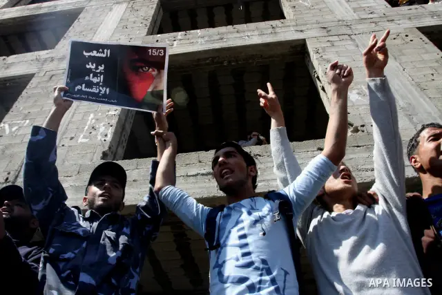Palestinian Hamas security forces participate with demonstrators in a protest calling for Palestinian political unity between Gaza's Hamas rulers and the Fatah-dominated Palestinian Authority which rules from Ramallah, o...